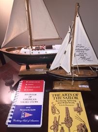 Two of several sailboat models; informative books for sailors