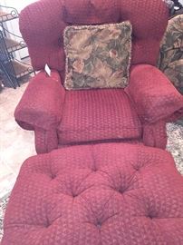 One of two chairs and ottomans