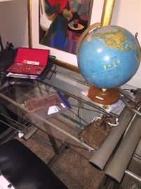 One of two clear top desks; globe