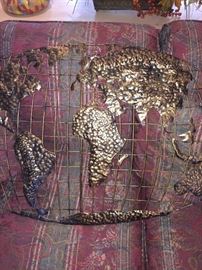 Carved out "globe" wall hanging