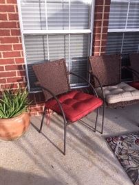 Two of four matching  matching chairs (two red cushions; two tan cushions)