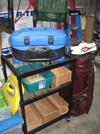 Downstairs Garage  Radio tool box, Golf bag, Rolling shelf unit, 