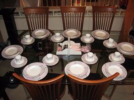 Living room  A. Sibau 6 Dinning room chairs, Large Glass top table,  Beautiful Pink and Grey china set, Pink tableware