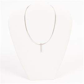 18K White Gold and Diamond Movado Necklace: An 18K white gold and diamond pendant on snake chain by Movado. This necklace comes in the original case.