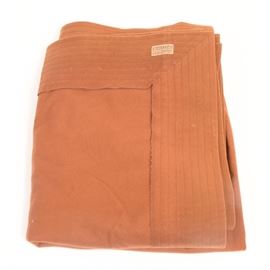 Hermes Sport Blanket: A vintage Hermes Sport blanket. This circa 1980s blanket is burnt orange in color and is made of mohair. A label at one corner reads, “Hermès Sport Paris.”