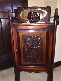 Beautiful carved music cabinet with mirror