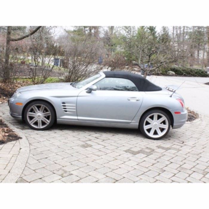 2005 Chrysler Crossfire Limited 2-Door Roadster: A single owner 2005 silver Chrysler Crossfire Limited 2-door Roadster convertible. This mid-size touring convertible is silver with a black cloth top roof, and has a red leather and tan interior with two seats. It has 66,876 miles; VIN is 1C3AN65L05X025012. Manual is included.