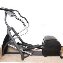 Precor EFX546 Elliptical Machine: A Precor EFX546 elliptical trainer with variable cross ramp.