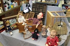 dolls /printers boxes / hand made dolls crib / brass lamps / wicker bench / collectible clocks