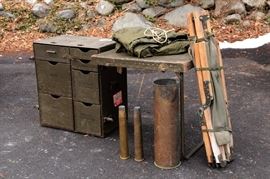 military folding field desk / canvas cot / shelter half / and some surplus brass shell casings