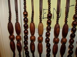 close up of carved wooden beads room divider two available