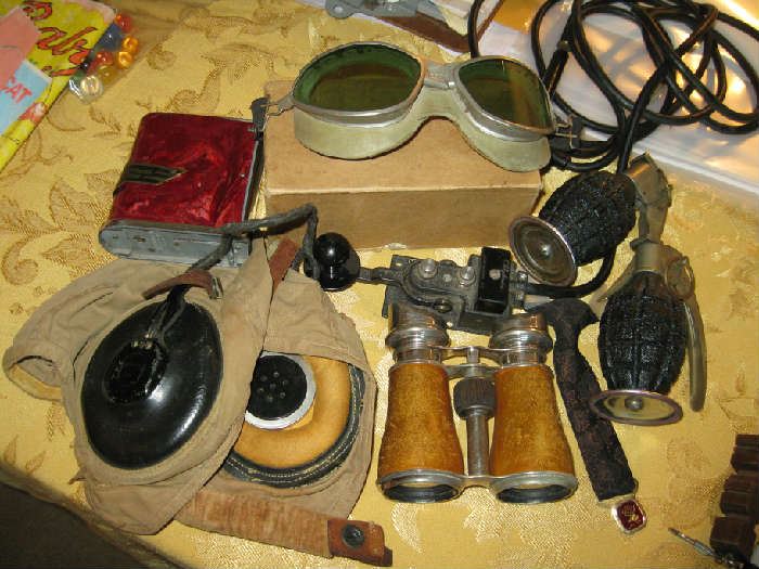 assortment of US Navy flyer equipment.  Pineapple   Hand grenades are  table lighters.
