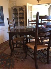 Country French draw-leaf table with ladder-back arm & side chairs