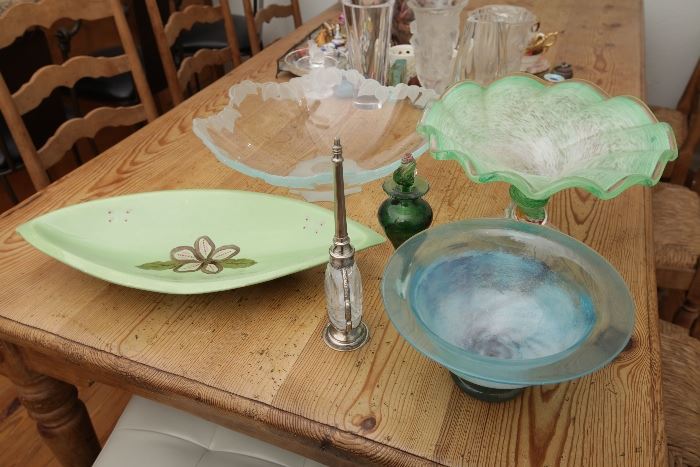 The blue bowl in front and the green perfume bottle are sold.