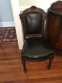 Two available black leather antique chairs 