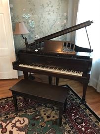 Very old baby grand mahogany piano - all it needs is new keys - and a little TLC..such a "statement piece!"
