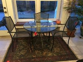 Wrought iron table and 4 chairs.