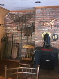Many antique and vintage rustic objects like sleds, snowshoes, yokes, rakes and other implements, etc.