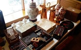 Copper pitchers, Asian porcelain, printing press letter blocks