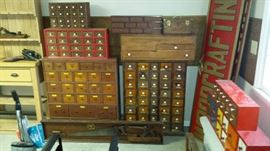 Many antique and antique style woodworking chests and cabinets with multiple small drawers