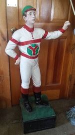 One of several antique and modern lawn jockeys, this one in the uncommon Yunich silks