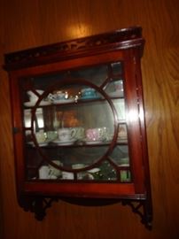 Wall cabinet with cups/saucers
