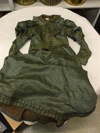 Dress # 65.   1890s green/gold silk lady's dress - some buttons on the shirtwaist are missing, some underarm staining, waist of skirt has significant wear, wear on jacket from collar.  bust 28", shoulder 26", waist 26"