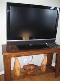 42" LG Flat screen TV,  console table, wood carvings 