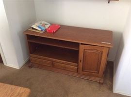 Oak cabinet with shelves for display and doors for storage. Measurements:  50"L x 26" H x 19"D