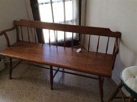Early American Maple Deacon's bench, features turned spindles on the back and legs.