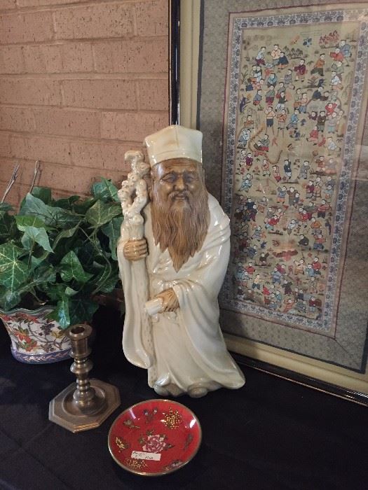 Confucius statue and other Asian touches are evident throughout the house.