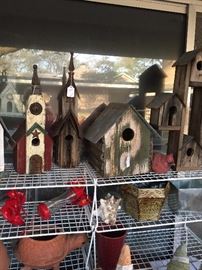 Some of the many bird houses and bird feeders