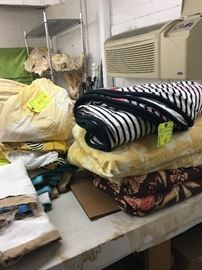 Yellow and white silk tablecloth (left) is sold