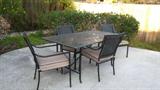 Glass top patio table and 6 chairs- very nice
