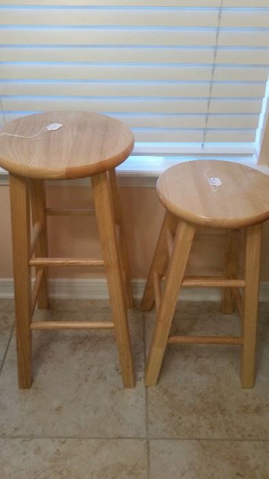 Two bar stools one short and one tall.  Again, solid wood.