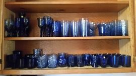 Multiples of blue glasses of all shapes and sizes. Not shown: teacups, mugs and small wine glasses.
