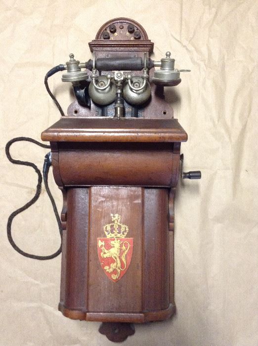 Antique wall phone with crank and hand piece. Norway? 