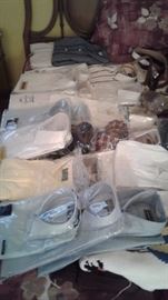Dozens of men's shirts new and dry cleaned