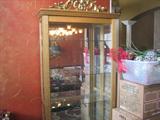 Large display cabinet with sliding front door