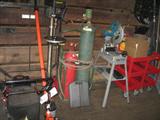 push lawn mower, echo chainsaw pole pruner, large drill press, cutting torch, makita metal cuttoff saw, utility tool carts