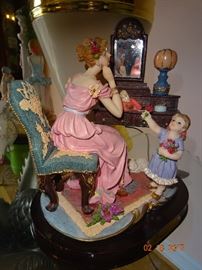 A beautiful Demonte porcelian figure. Just a mama and her girl.