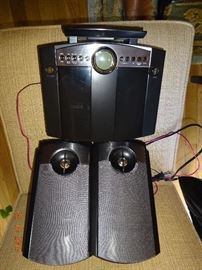 Small black stereo system with speakers