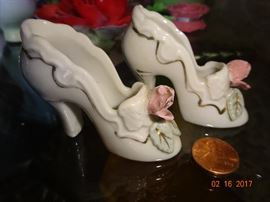 Small set of Demonte white porcelain handmade shoes for decor.