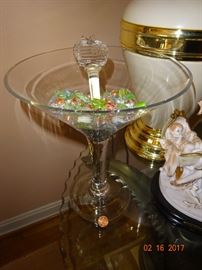 Beautiful and elegant glass stemmed decorative bowl with various colored marbles and glass swivel stirrer.