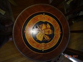 Hand-crafted and hand-painted display on top of round side table.
