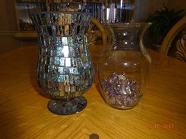Vintage and hand-made mirrored glass vase. A clear glass vase with assorted decorative rocks inside.