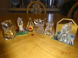 Various collectables of glass, crystal and porcelain figurines for decoration.