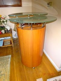 The view of the wine/glassware storage unit as a whole with glass table on top.