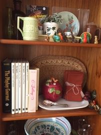 Cook Books, McCoy Pottery Mugs, Vintage Linens, Salt & Pepper Shakers in the Teak Mid Century Danish Cabinet in the kitchen