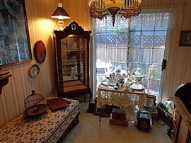 Carved and lighted oak display cabinet